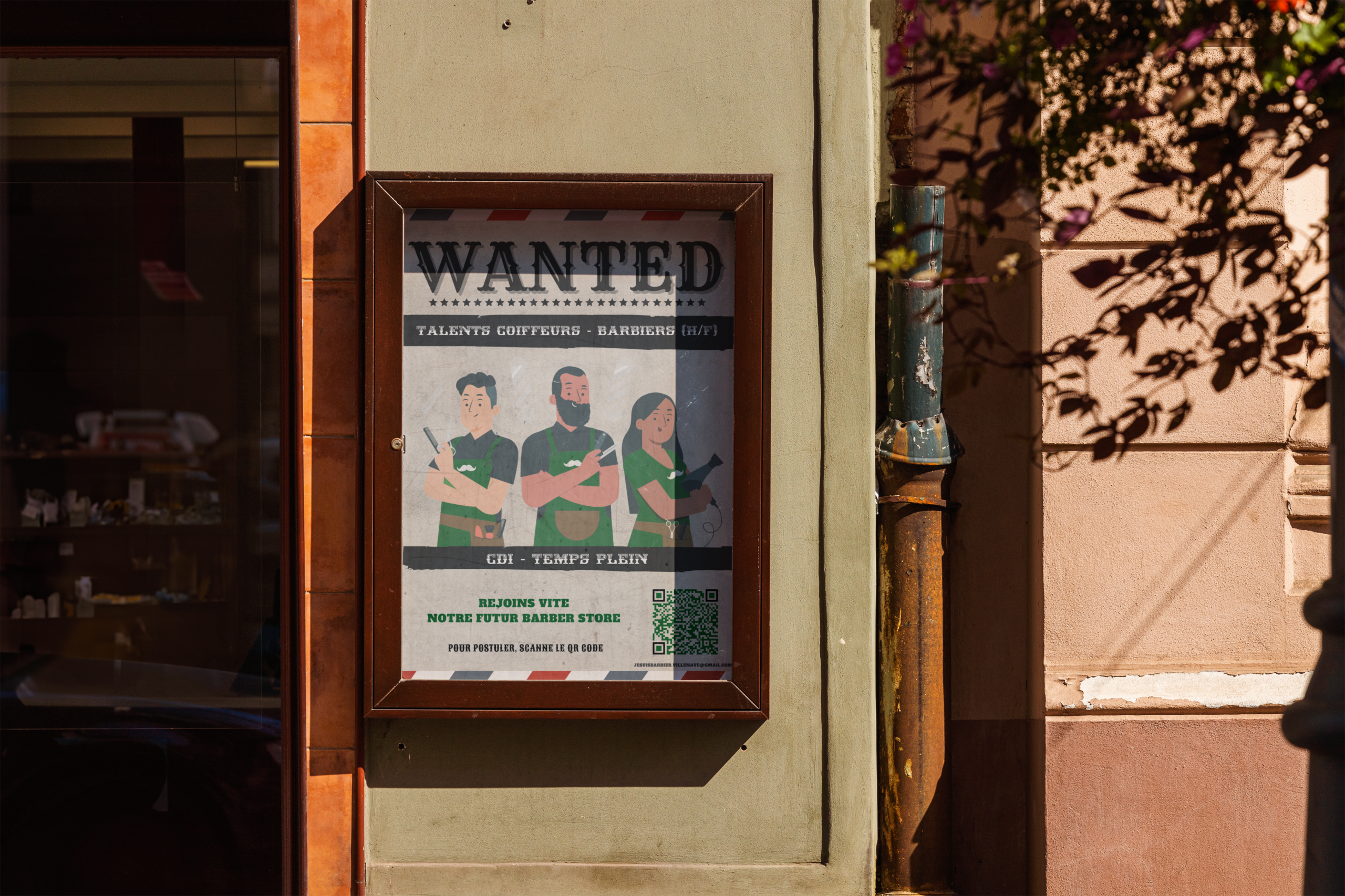 Affiche offre d'emploi barber shop dans armoire vitrée.