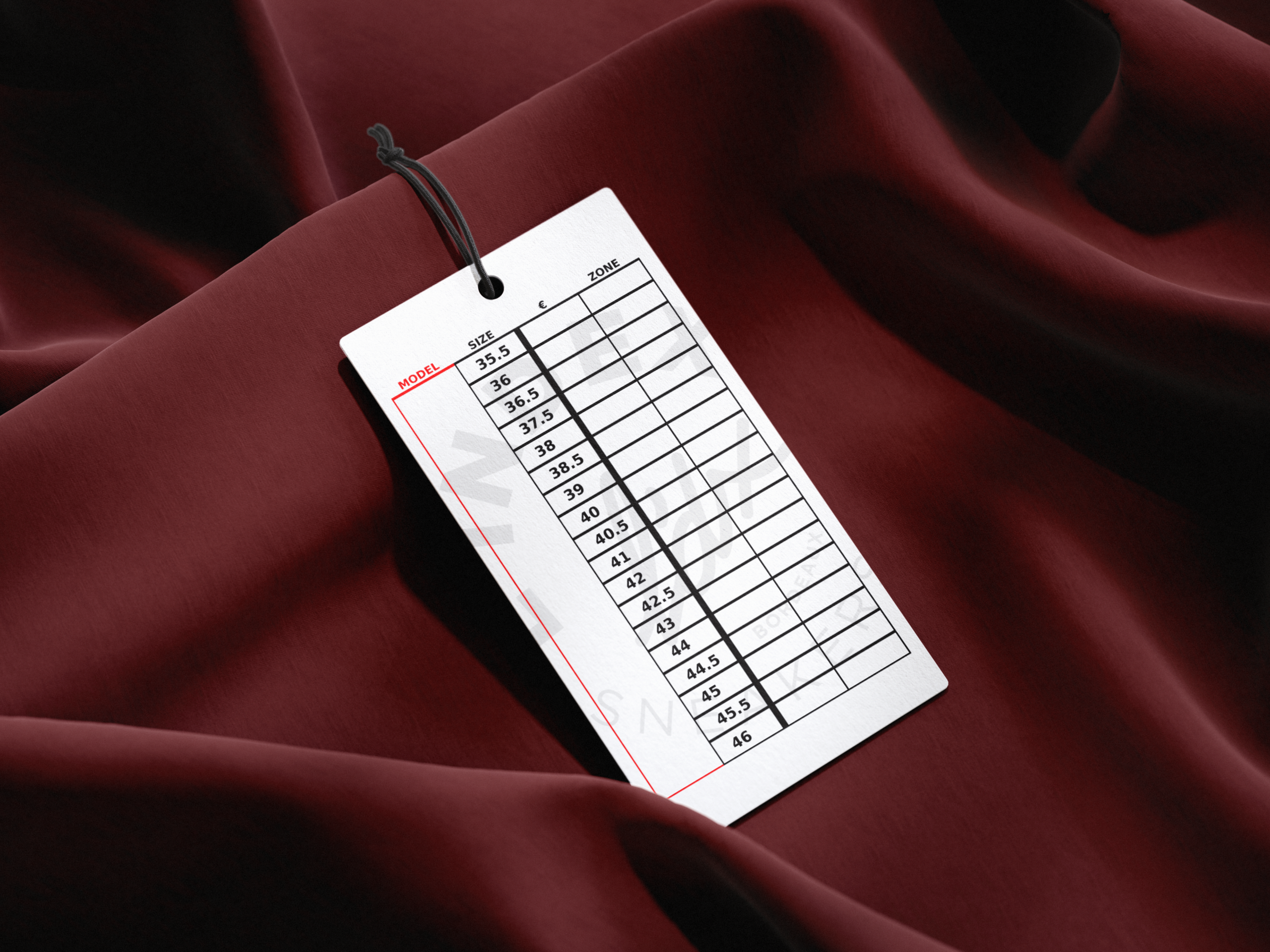 Verso d'une étiquette de suspension blanche L'INDEX SHOP.